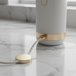 Electric spin scrubber USB-C charging on marble surface
